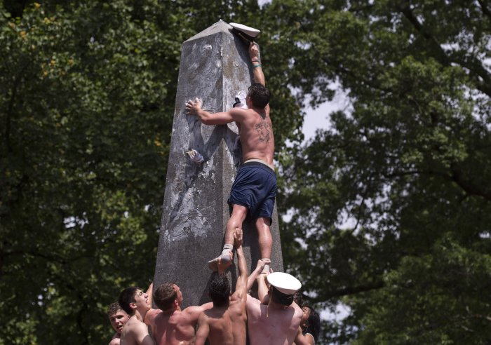 U.S. Naval Academy plebes race to the top during annual 