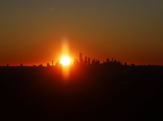 Sunrise Behind One World Trade Center and Manhattan Skyline