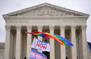Demonstrators rally as the Supreme Court hears arguments on LGBTQ discrimination in Washington, DC