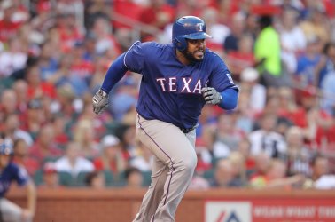 Texas Rangers Prince Fielder runs out a ball