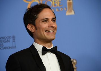 Gael Garcia Bernal wins an award backstage at the 73rd annual Golden Globe Awards in Beverly Hills