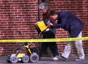 Police search a Chicago lot for evidence of mass burial by executed killer John Wayne Gacy