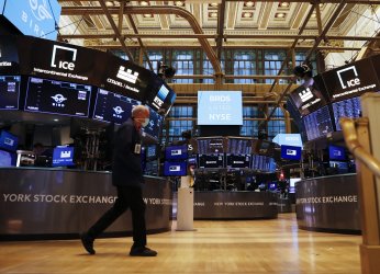 Traders Work on the Floor at the New York Stock Exchange