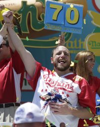 Joey Chestnut celebrates at the Nathan's Famous Hot Dog Contest