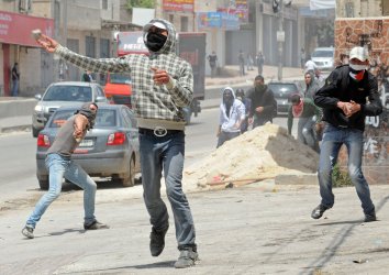 Palestinians clash with Israeli soldiers on the 63rd anniversary of "Nakba" in Qalandiya, West Bank
