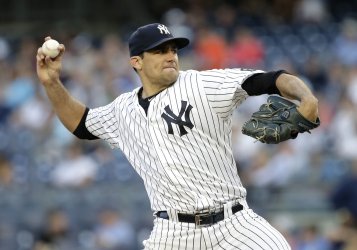 Yankees starting pitcher Nathan Eovaldi throws a pitch