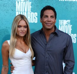 Joe Francis (R) and guest arrive at the 2012 MTV Movie Awards in Universal City, California