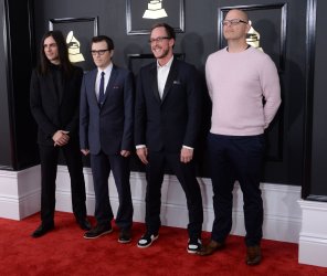 Brian Bell, Rivers Cuomo, Scott Shriner, and Patrick Wilson arrive for the 59th annual Grammy Awards in Los Angeles