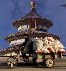Chinese Worker Wears Face Mask in Beijing, China