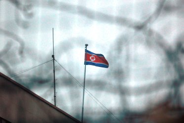 The North Korean flag flies outside its embassy in Beijing