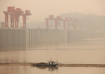A heavy fog hangs over the Three Gorges Dam on the Yangtze River