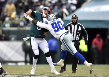 Eagles' Nick Foles gets hit by Cowboys' DeMarcus Lawrence
