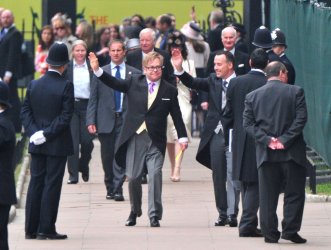 Singer Elton John arrives for the royal wedding in London