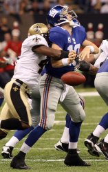 New York Giants quarterback Eli Manning fumble under pressure from New Orleans Saints Roman Harper.