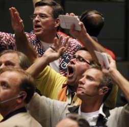 Traders yell in at CME Group in Chicago