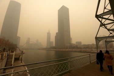 A heavy, hazardous smog hangs over downtown Tianjin, China