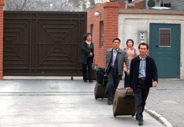 North Koreans leave their embassy in Beijing