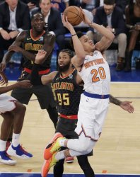 Knicks Kevin Knox drives to the basket leaps to the basket