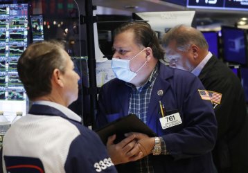 Traders Work on the Floor of the New York Stock Exchange