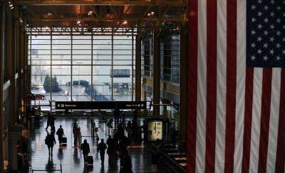 Travelers pass through Reagan National Airport