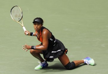 Naomi Osaka of Japan returns a ball at the US Open