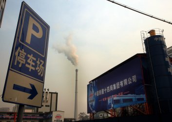 Smoke billows from a power plant in Beijing
