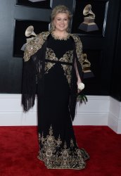Kelly Clarkson arrives at the 60th Annual Grammy Awards in New York