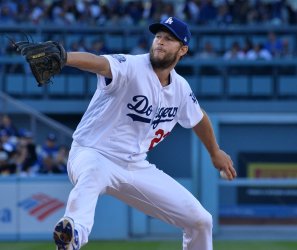 Dodgers' starting pitcher Clayton Kershaw delivers against the Giants in Los Angeles
