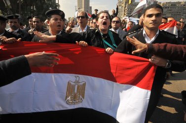 Egyptian Police demonstrate after the overthrow of Egyptian President Mubarak in Cairo