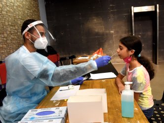 An Israeli Girl Takes A COVID-19 Antigen rapid test In Jerusalem