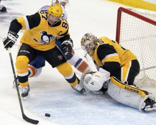 Pittsburgh Penguins Sidney Crosby Clears Pucks