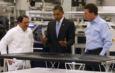 U.S. President Obama tours the Solyndra solar panel company in California