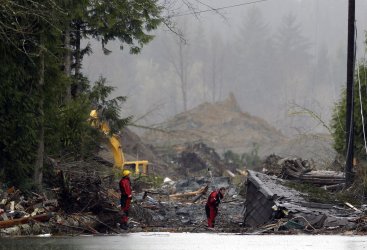 Search and rescue personnel search for survivors in Washington State