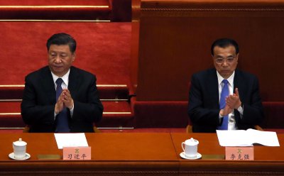 Xi And Li Clap During The CPPCC Closing Session in Beijing, China