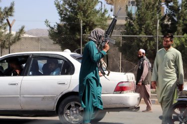 Taliban Fighters Stand Guard Outside International Airport