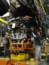 Workers install engine in Explorer at Ford plant in Chicago