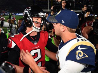 Falcons Matt Ryan (L) and Rams Jared Goff (R) hug after their NFC Wild Card Playoff Game