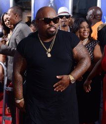 Cee-Lo Green attends the premiere of "Sparkle" with parents in Los Angeles
