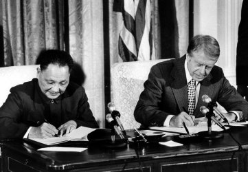 Jimmy Carter and Deng Xiaoping during a signing ceremony at the White House.