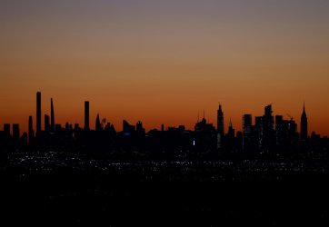 Sunrise Behind One World Trade Center and Manhattan Skyline