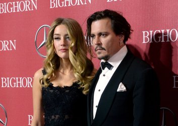 Amber Heard and Johnny Depp attend the Palm Springs International Film Festival in Palm Springs, California