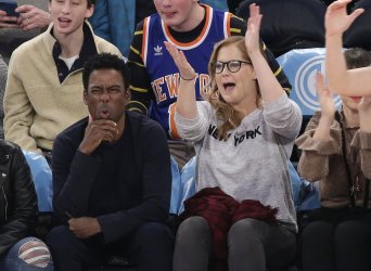 Amy Schemer and Chris Rock watch the New York Knicks