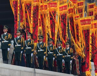 Chinese soldiers stand by during in a memorial ceremony for Yellow Emperor in Qiaoshan, China