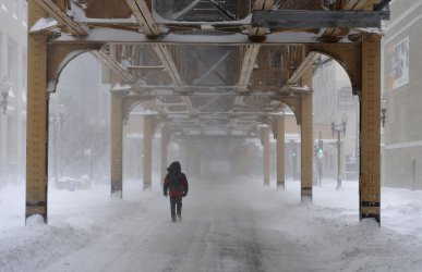 Man walks through snow in Chicago
