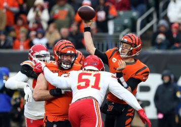 Bengals Joe Burrow Throws Under Pressure from Chiefs Mike Danna