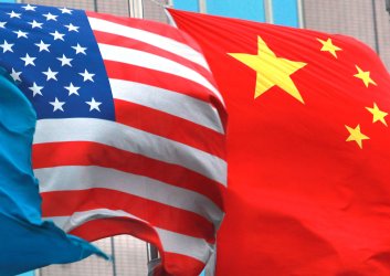 Both American and Chinese national flags fly in Beijing