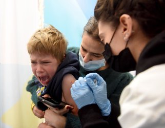 An Israeli Boy Receives A COVID-19 Vaccine In Jerusalem