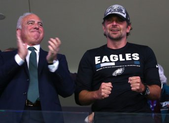 Actor Cooper with Eagles owner Lurie at Super Bowl LII in Minneapolis