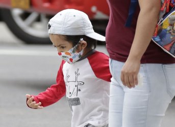 Children Wear Masks To Guard Against Coronavirus in New York