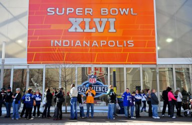 Fans wait in line to get into the Fan Zone area in Indianapolis